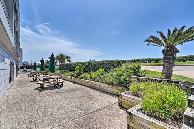 surrounding community featuring a garden and a patio