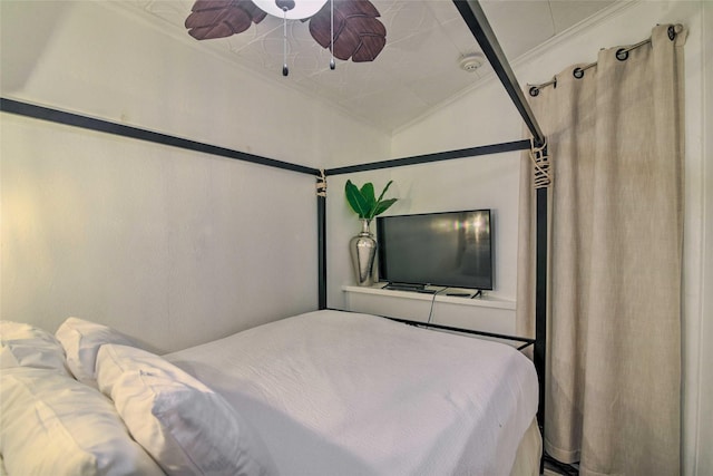 bedroom with lofted ceiling and crown molding