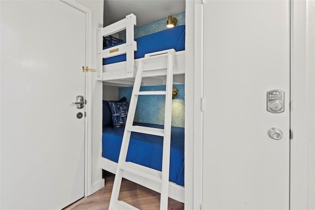 bedroom with wood finished floors