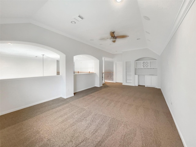 unfurnished living room with built in shelves, carpet, visible vents, vaulted ceiling, and baseboards