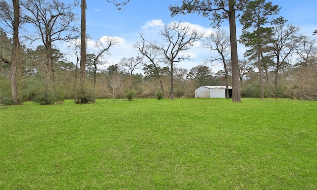 view of yard with an outbuilding and a pole building