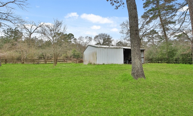 view of yard featuring an outbuilding and an outdoor structure