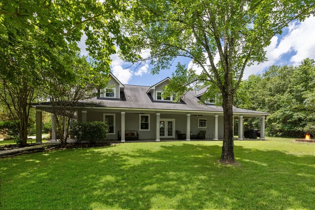 view of front of home featuring french doors and a front lawn