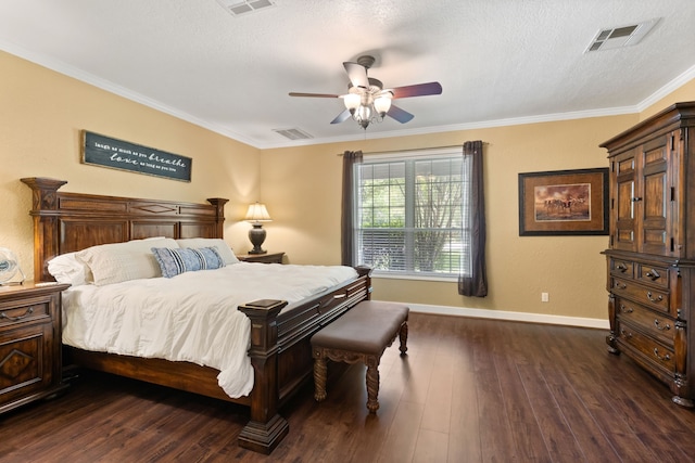 bedroom with visible vents, crown molding, baseboards, and dark wood-style flooring