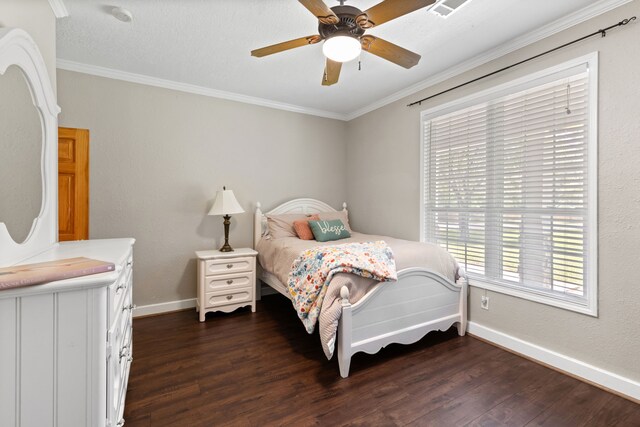 bedroom featuring crown molding, dark wood-style floors, baseboards, and ceiling fan
