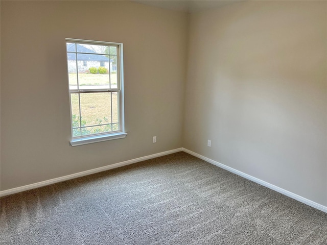 empty room with carpet flooring and baseboards