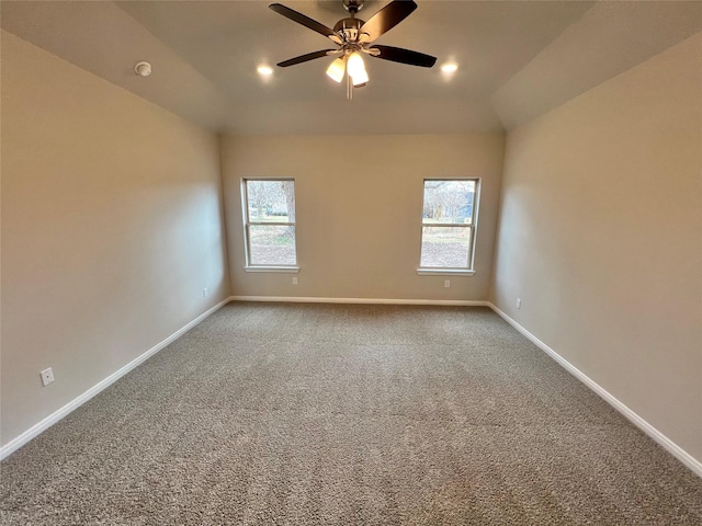 spare room with plenty of natural light, baseboards, ceiling fan, and carpet flooring