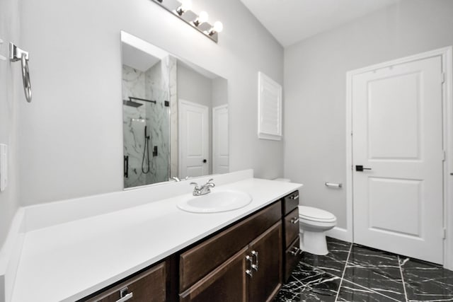 full bath with toilet, marble finish floor, a marble finish shower, and vanity