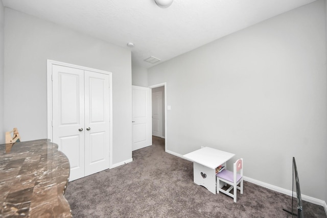 recreation room with carpet floors and baseboards