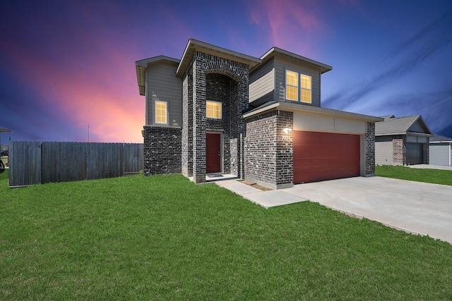 view of front of house with a garage, brick siding, fence, driveway, and a lawn