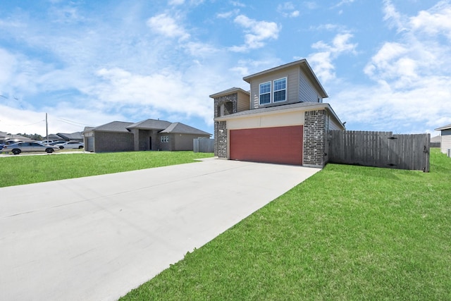 view of front of house with driveway, an attached garage, fence, and a front lawn