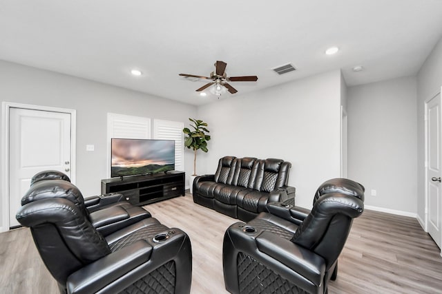 living room featuring ceiling fan, recessed lighting, visible vents, and light wood-style floors