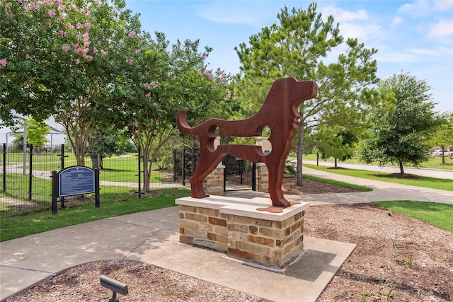 surrounding community with a yard and fence