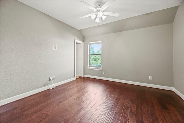 spare room featuring lofted ceiling, ceiling fan, baseboards, and wood finished floors