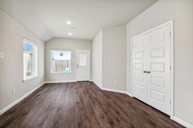 interior space with visible vents, dark wood finished floors, recessed lighting, baseboards, and vaulted ceiling