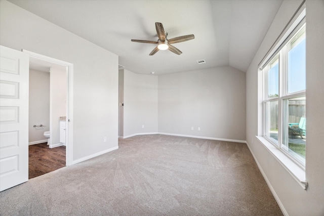 unfurnished room featuring ceiling fan, carpet, visible vents, and baseboards