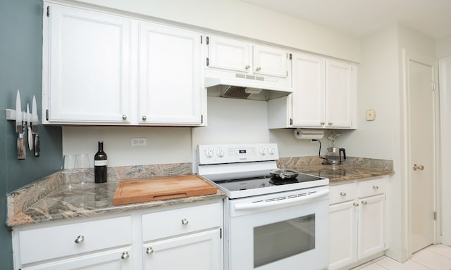 kitchen with light stone countertops, white electric range, under cabinet range hood, and white cabinetry