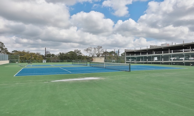 view of sport court featuring fence