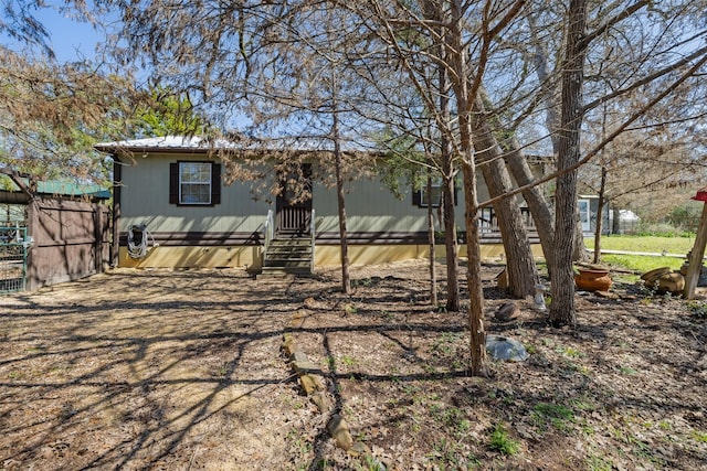 exterior space with entry steps and fence