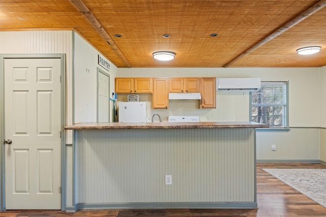 kitchen featuring wood ceiling, a wall unit AC, under cabinet range hood, and white refrigerator