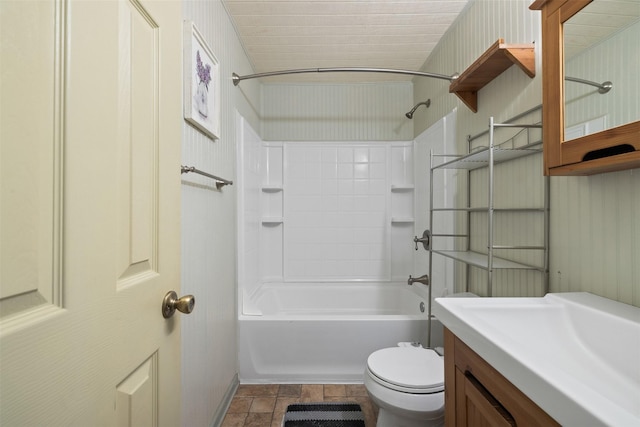 bathroom featuring bathtub / shower combination, vanity, and toilet