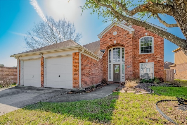 traditional-style home with brick siding, an attached garage, a shingled roof, fence, and driveway