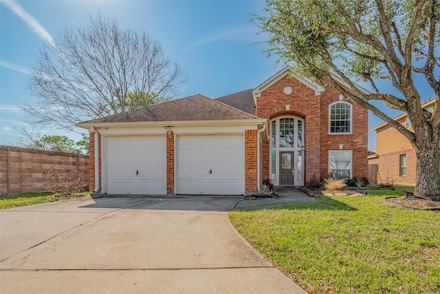 traditional home with a front yard, fence, an attached garage, concrete driveway, and brick siding