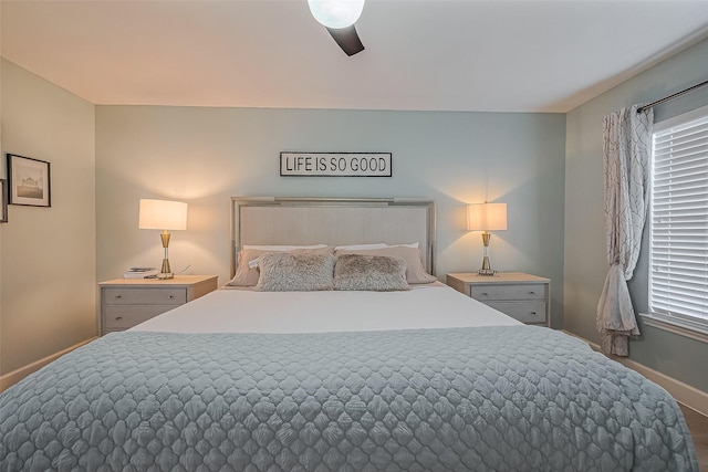 bedroom featuring baseboards and a ceiling fan