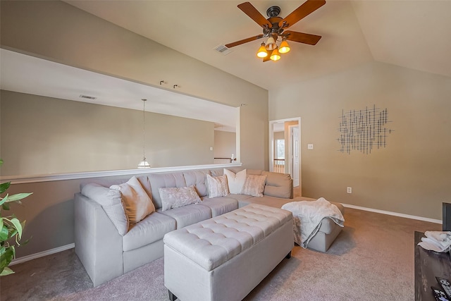 carpeted living area with lofted ceiling, baseboards, and visible vents