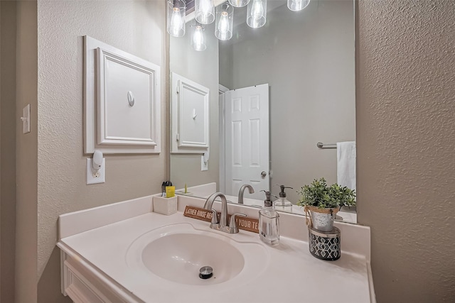 9314 Dune Gate Ct, Humble, TX 77396 - bathroom featuring a textured wall and vanity