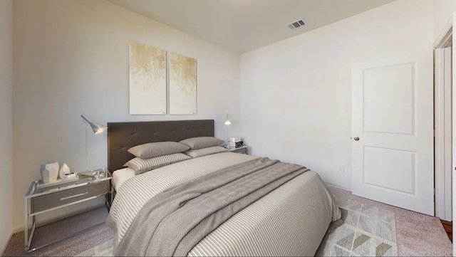 carpeted bedroom with visible vents