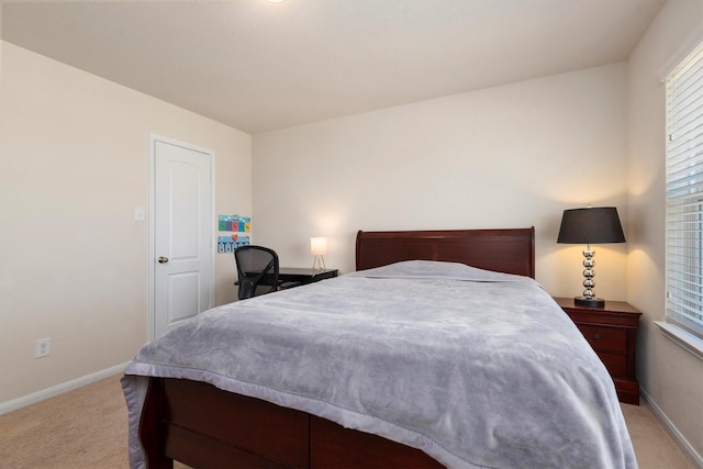 bedroom with carpet and baseboards