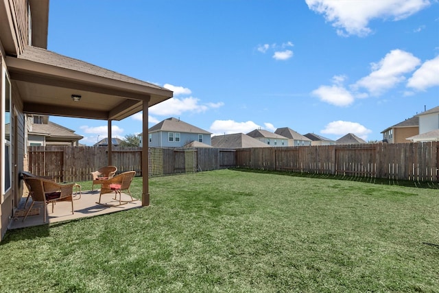 view of yard featuring a patio and a fenced backyard