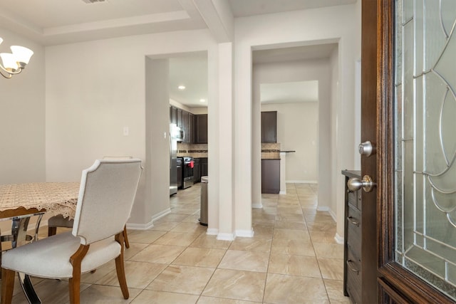 entryway featuring light tile patterned floors, recessed lighting, visible vents, and baseboards