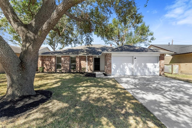 single story home featuring a garage, brick siding, concrete driveway, and a front yard