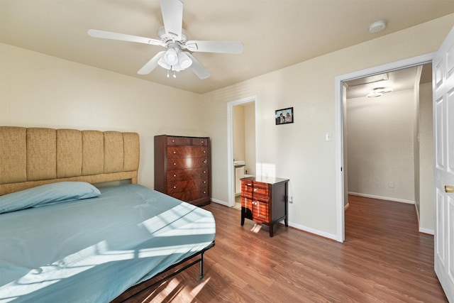 bedroom with ceiling fan, baseboards, and wood finished floors