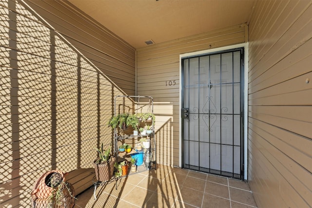 view of exterior entry with visible vents