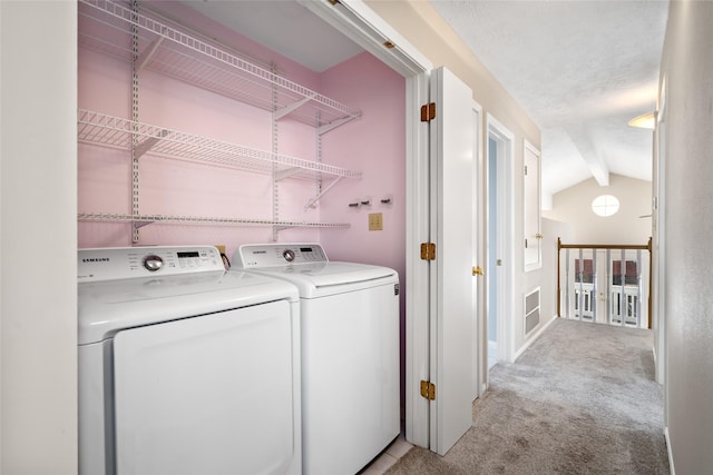 clothes washing area featuring laundry area, independent washer and dryer, and light colored carpet