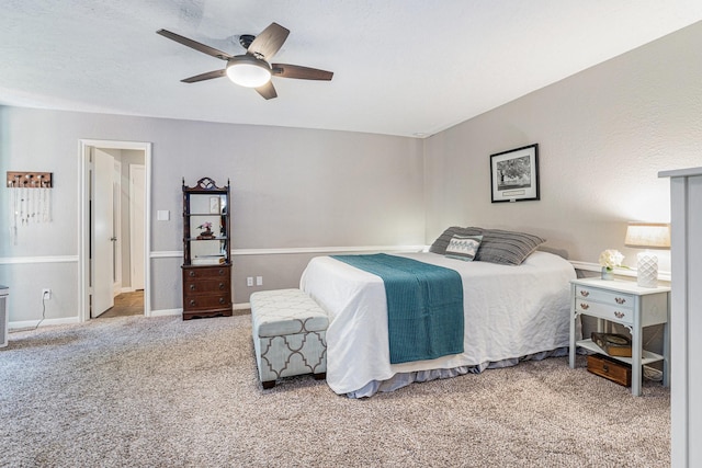 bedroom with baseboards, a ceiling fan, and carpet floors