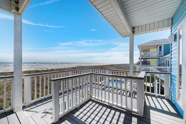 balcony with a view of the beach and a water view