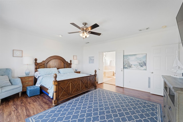 bedroom with visible vents, ornamental molding, and wood finished floors