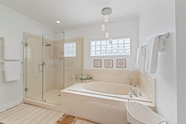 full bath featuring a stall shower, a bath, and crown molding