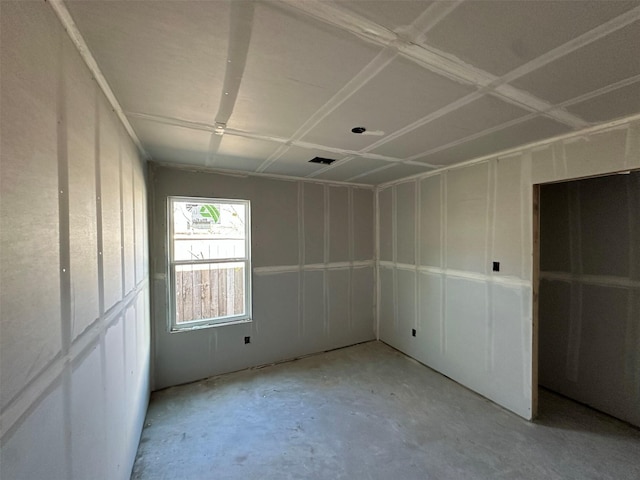 unfurnished bedroom with visible vents and unfinished concrete flooring