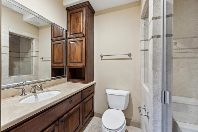 bathroom featuring toilet, vanity, baseboards, tile patterned floors, and a stall shower