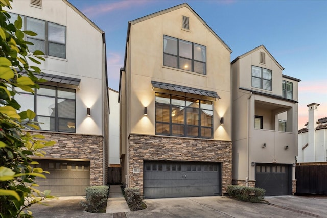 modern home with a garage and stucco siding