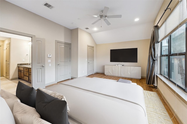 bedroom with recessed lighting, visible vents, light wood-style flooring, vaulted ceiling, and baseboards