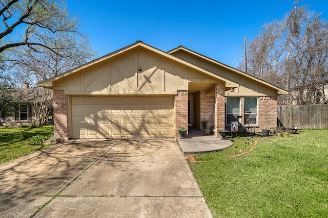 view of front of property with driveway, a front lawn, fence, an attached garage, and brick siding