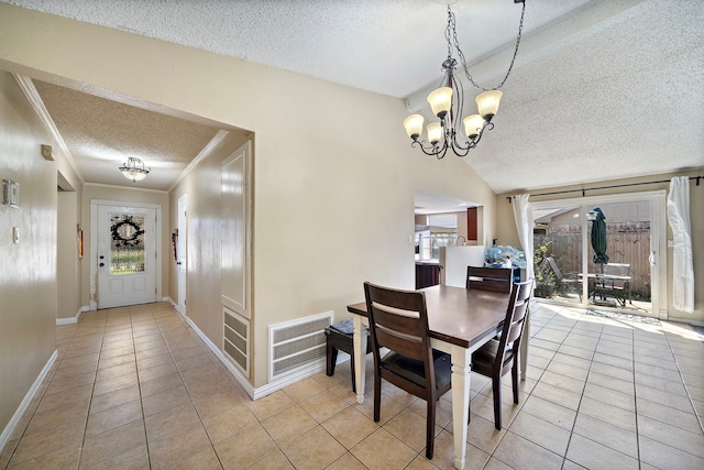 dining room with light tile patterned floors, visible vents, lofted ceiling, and an inviting chandelier