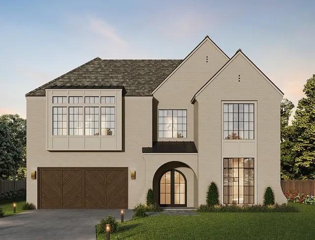 view of front of property with a garage, a front lawn, driveway, and fence