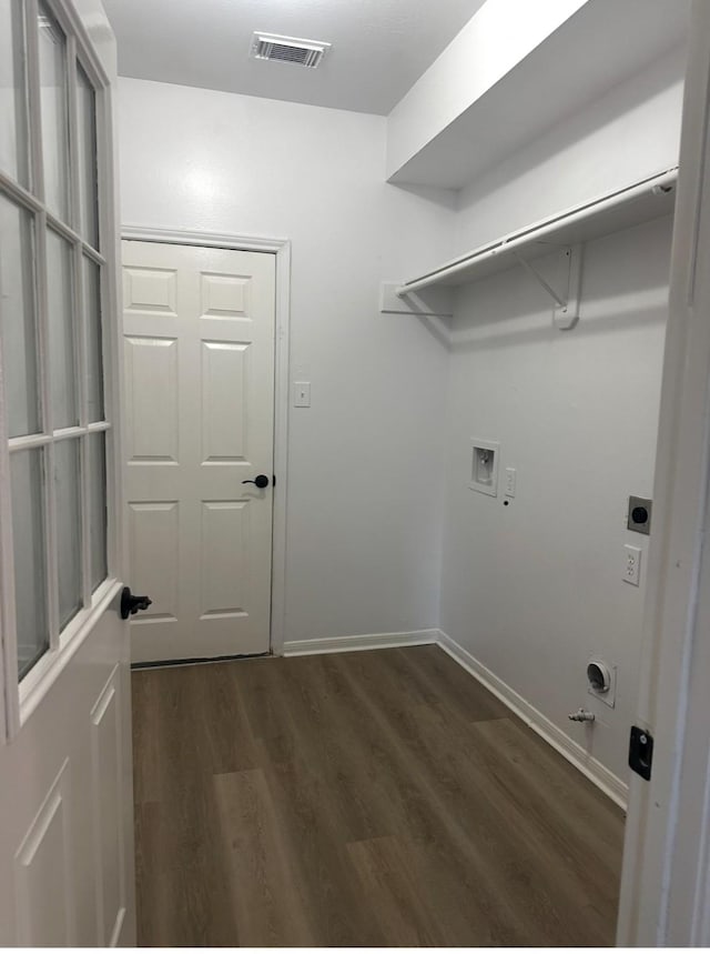 laundry area with laundry area, dark wood finished floors, gas dryer hookup, hookup for a washing machine, and electric dryer hookup